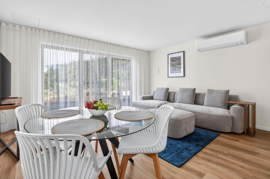 Living room and dining area in the two-bedroom apartment